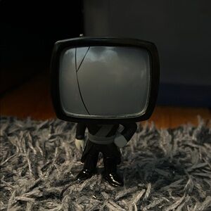 Black and Gray TV Head Figurine